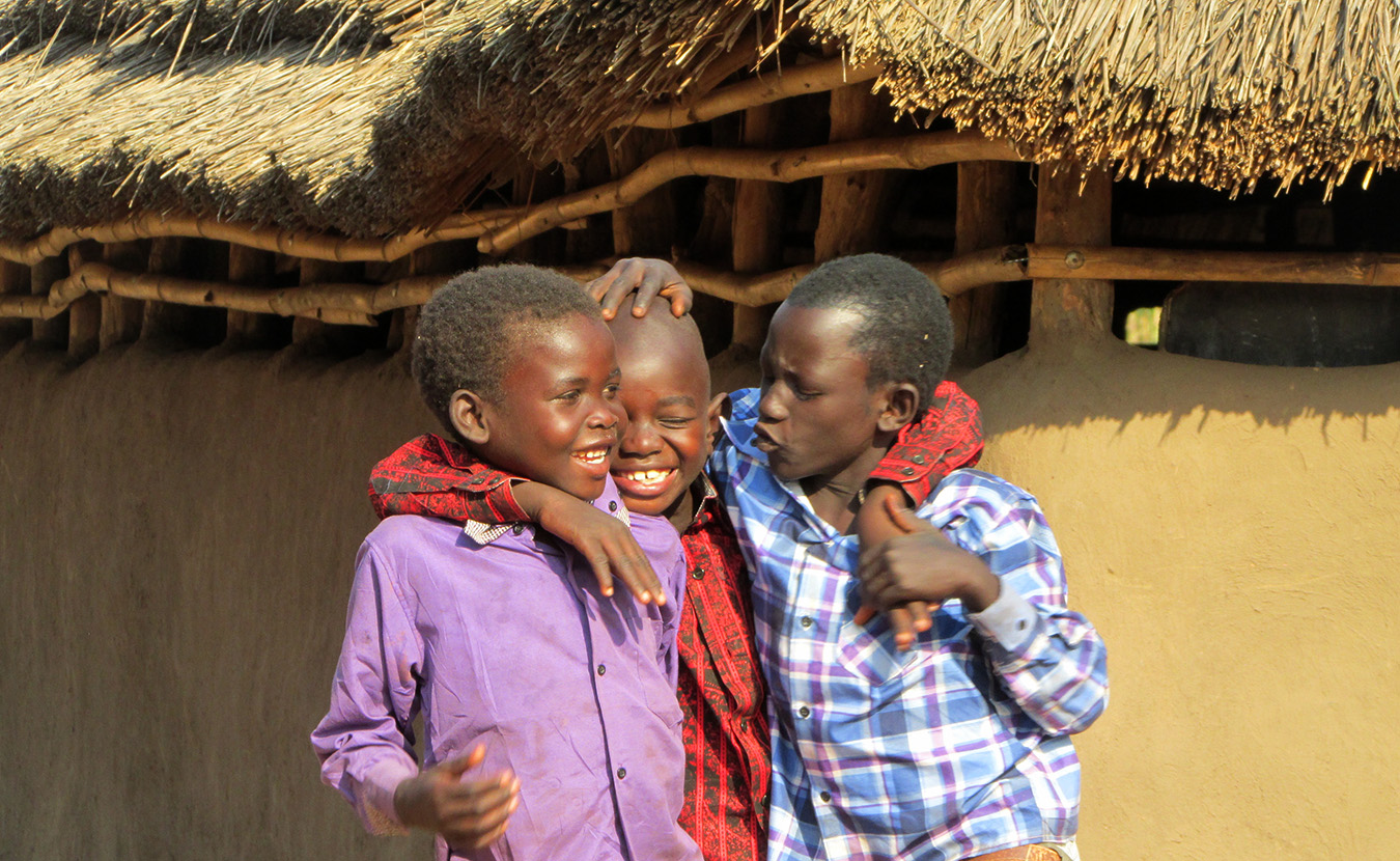 Young Moru boys playing after Christmas celebration at church. | Photo by Will and Theresa Reed