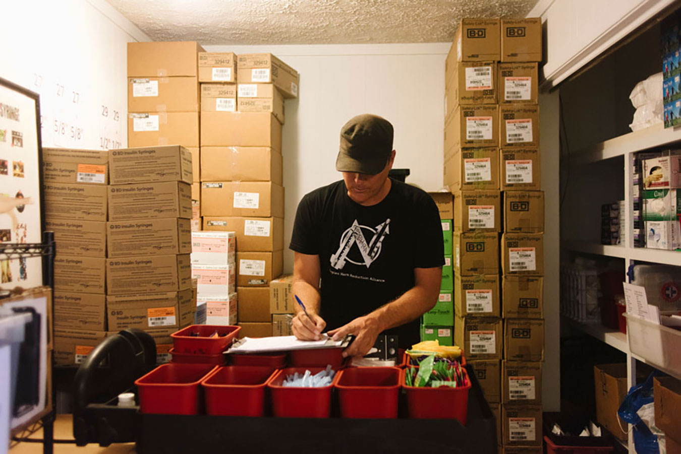 Abert at work in the IRA store room. An IRA participant, Cindy, says she has received more solutions at IRA than from anywhere else. | Photo by Natasha Komoda