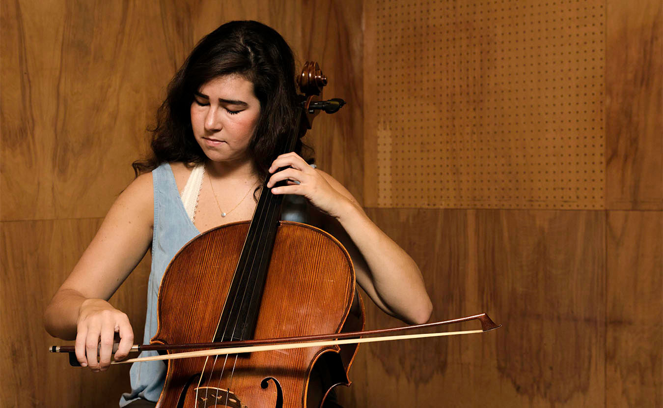 As a music education major, Susens must learn how to play not just her instrument of choice (cello) but every instrument offered in music programs, including string, brass, woodwind, and percussion instruments. | Photo by Ben Meraz