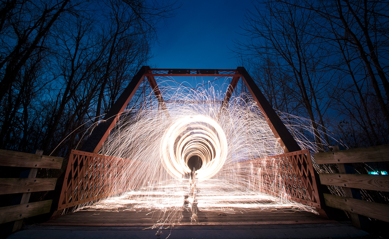 Nathan Clark spins steel wool on the Clear Creek Trail. This picture was a part of the photo gallery in 