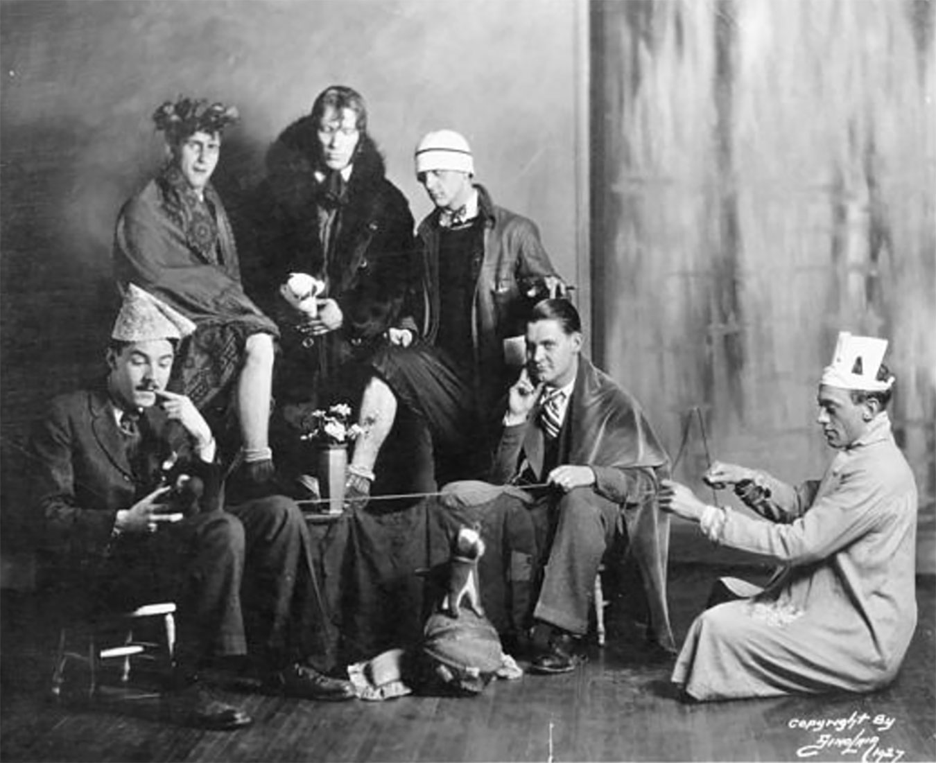 Monk (back row, center) became the chief spokesman of a group of absurdist artists he named the Bent Eagles. Carmichael wrote on the back of this photograph: "Some more crazy musicians from Indiana. Moenkhaus in fur collar, Eddie Wolf with bow and arrow." | Photo courtesy of Indiana University Archives of Traditional Music