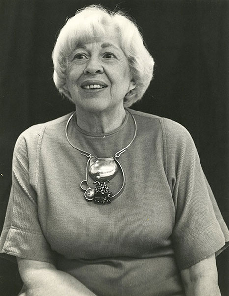 Eikerman is wearing one of her signature pieces made out of silver, green onyx, and gold. | Photo courtesy of Indiana University Archives
