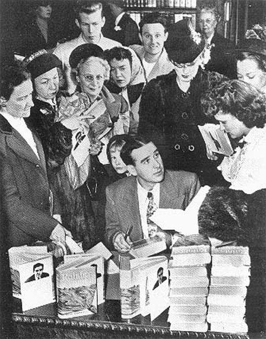 Writer Ross Lockridge Jr. (RLJ) killed himself on March 6, 1948, just two months after his book "Raintree County" was published. Pictured here, RLJ is signing autographs at an L. S. Ayres department store in Indianapolis on January 20, 1948. This is the last known photograph of RLJ. | Photo by Robert Lavelle, "The Indianapolis News." Photographs from <a href="http://www.raintreecounty.com/bookphot.html" target="_blank" rel="noopener">raintreecounty.com</a> are used with permission of The Estate of Ross Lockridge, Jr.