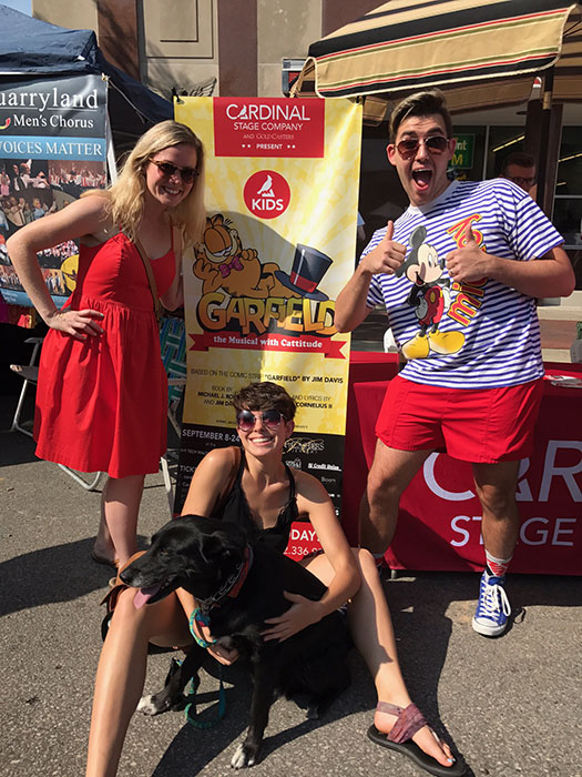 Cast members, left to right, Ashley Dillard, Anna Butler, Chris Krenning, along with a furry friend, at Pridefest on August 26.