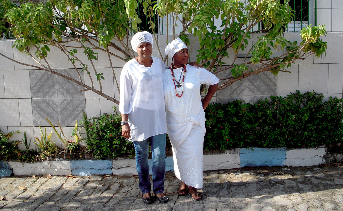 Abegunde (right) and Sueli, one of the women she interviewed while doing research on the role of women in Egungun (ancestral) society, in Brazil. | Courtesy photo