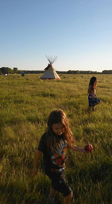 Martinez's sister, Kelly Tudor, took this photo is of her children, Ohanna (front) and Aslan Tudor, at Standing Rock in August 2016. | Photo by Kelly Tudor