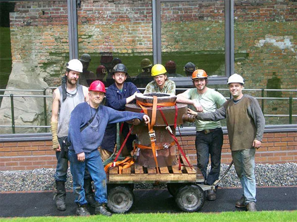 Iron casting crew in front of the historic Telford furnace in Coalbrookdale, England, at the International Conference of Contemporary Cast Iron Art 2009. From left, Chris Johns, Rick Batten, Will Vannerson, Nate Hensley, Chris Gerber, and Gerry Masse. The crew stands with Lady Dianne, the furnace they built, now in use at Sculpture Trails Outdoor Museum in Solsberry. | Courtesy photo