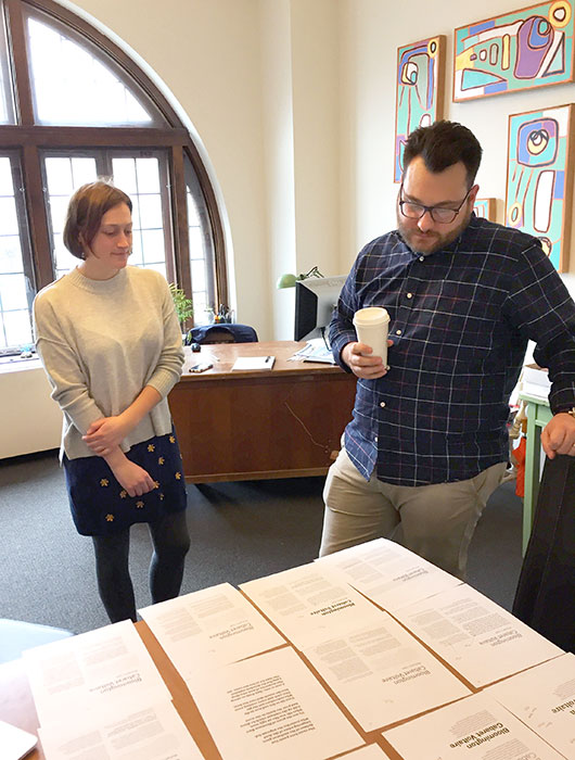 Limestone Post Marketing & Advertising Director Emily Winters and "A Sense of Place" designer AJ O'Reilly, from Felt Creative, look at font choices for our art magazine. | Limestone Post