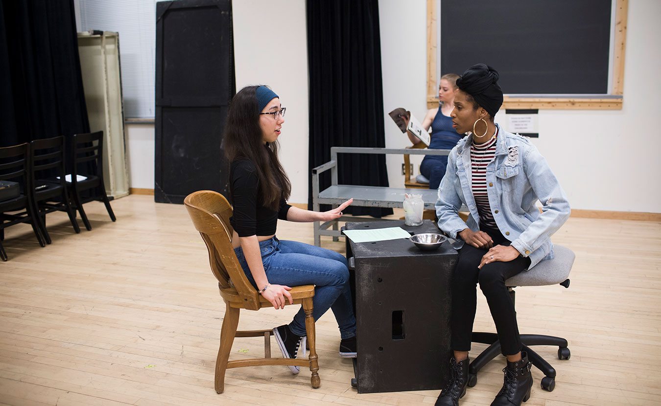 Jasmine (Nina Donville) teaches Nomfundo (Adrianne Embry) how to talk to nail salon clients. | Photo by Chaz Mottinger