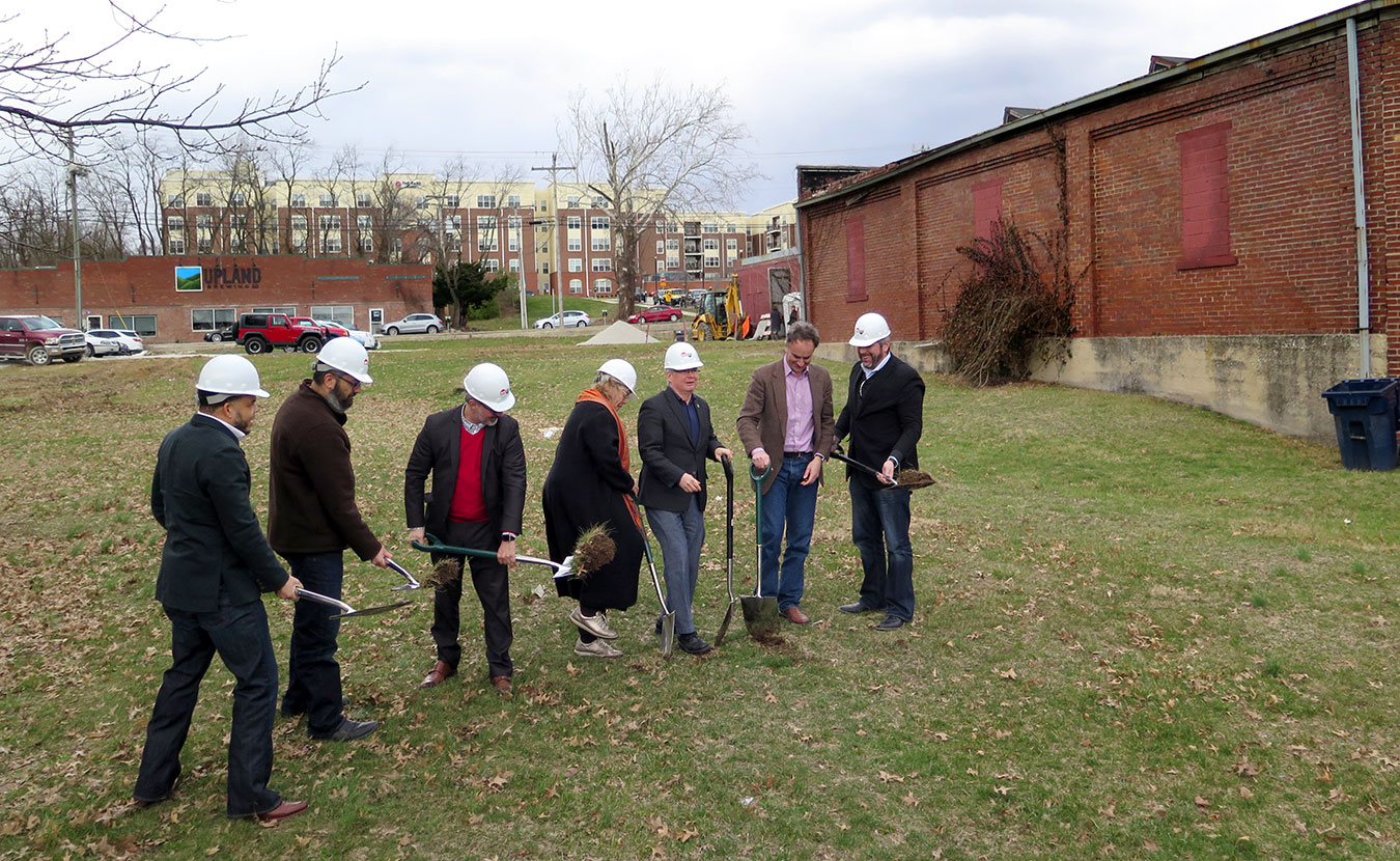 The groundbreaking ceremony on March 6 for the first phase of the Dimension Mill and Trades District; the original Dimension Mill is the building to the far right in the background. Breaking ground (l-r) are: Don Griffin, president, Bloomington Redevelopment Commission; Pat East; Craig McCormick, principal, Blackline Studio; Jane Martin, board president, Dimension Mill, Inc.; Mayor John Hamilton; Alex Crowley, director, Economic and Sustainable Development, City of Bloomington; and Jon Bohlander, principal, Anderson Bohlander. | Limestone Post