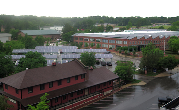 Installing solar panels in parking lots, such as at Showers Commons (pictured here), and on the roofs of buildings would allow the university to have enough solar energy to meet a large portion of its energy load without the need for any new real estate, says Flaherty. | Limestone Post