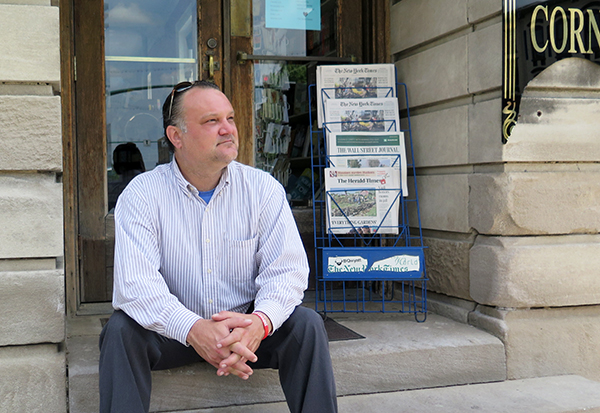 Richey sits on the steps of The Book Corner, which resides in a historic building on the east side of the downtown Square. | Limestone Post