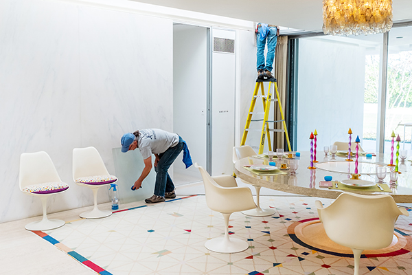 Bill Whaley and Ray Palmer clean the skylights in the dining room. | Photo by Adam Reynolds