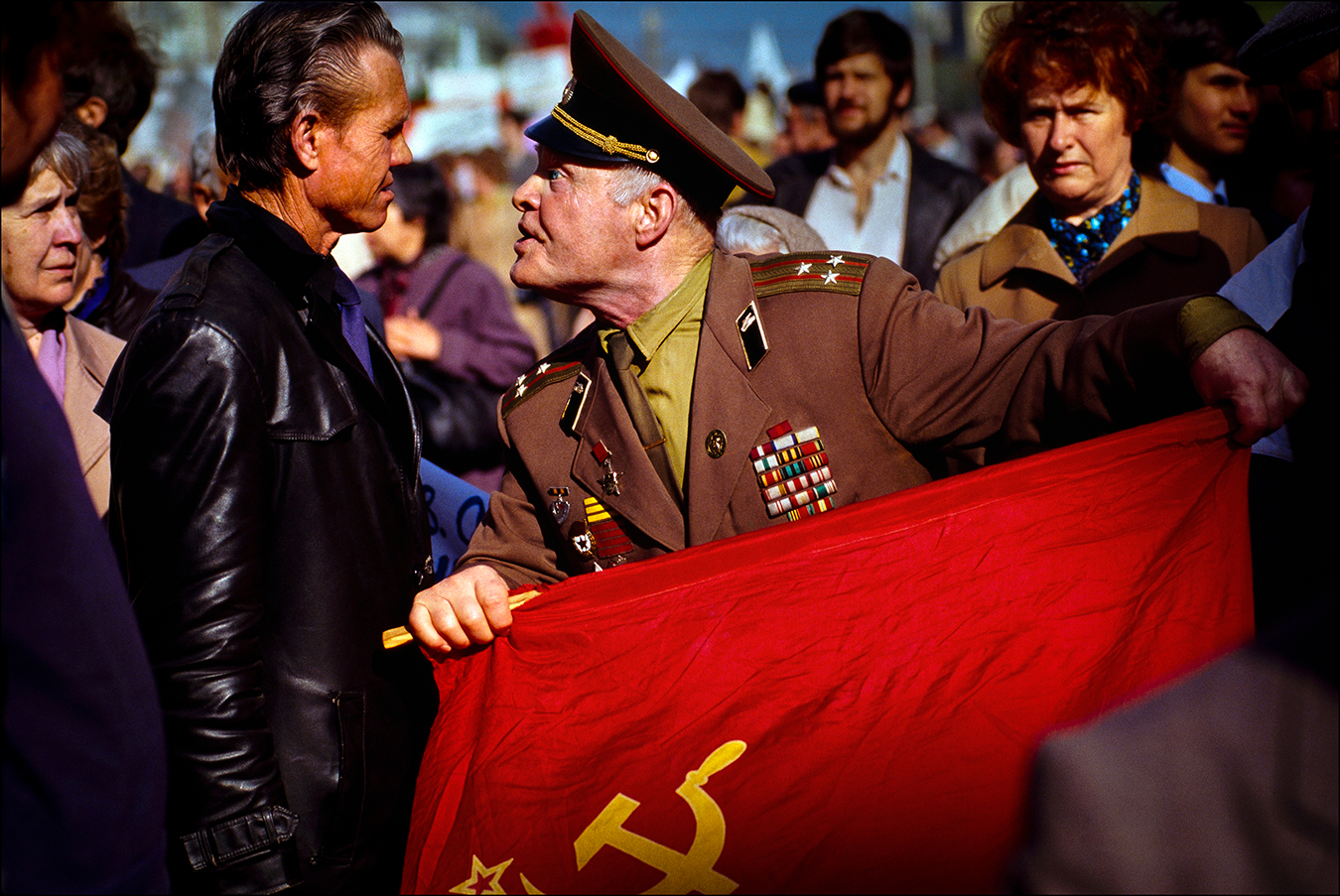 Shouting "traitor," a flag-waving colonel of the Soviet Army confronts a pro-democracy demonstrator at a May Day parade on Red Square in 1990. Hundreds of thousands of Soviet citizens turned a working-class holiday into an angry display of popular discontent with communist rule — a movement that would lead to the dissolution of the Soviet Union in December 1991. | © Steve Raymer / National Geographic Creative