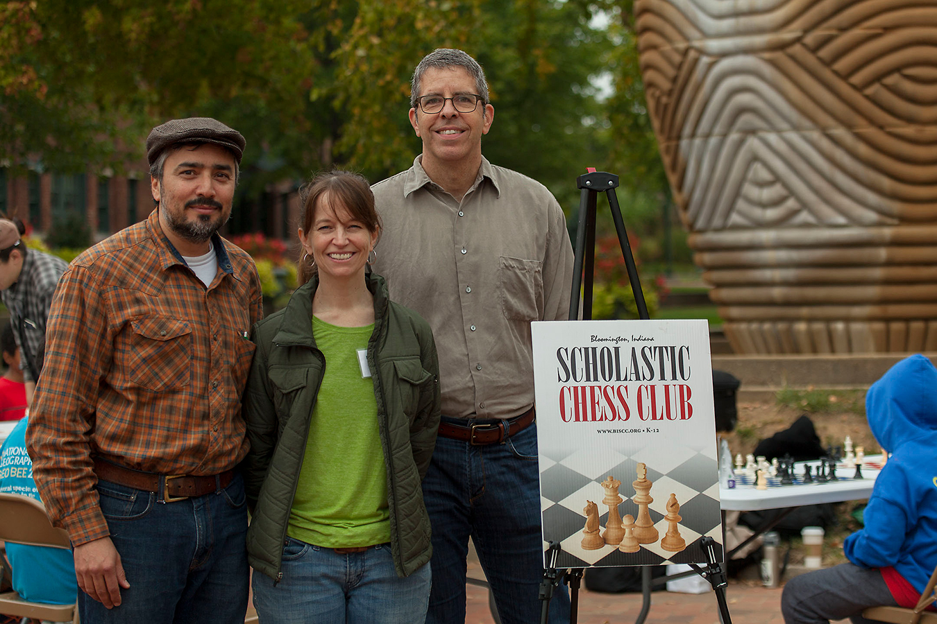 Medina, left, with Scholastic Chess Club member Rebecca Harris and former treasurer Neal Abdullah. | Courtesy photo