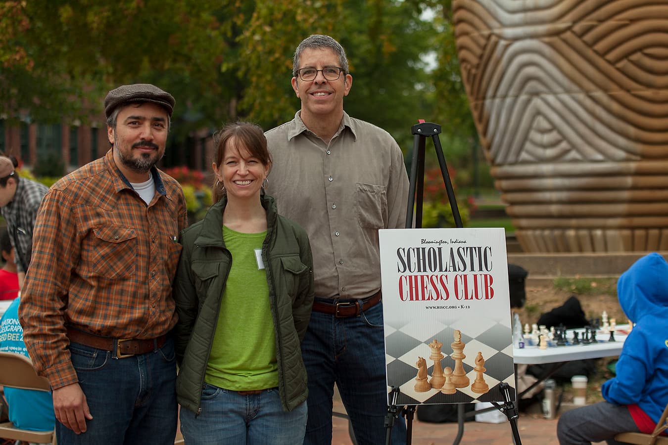 Medina, left, with Scholastic Chess Club member Rebecca Harris and former treasurer Neal Abdullah. | Courtesy photo