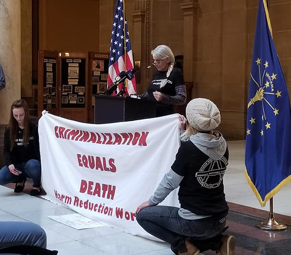 Christy Thrasher speaks at the Indiana Statehouse during a protest of the signing of House Bill 1359 — "a drug induced homocide law" that, Thrasher says, "would allow prosecution of the person supplying the drugs that led to an overdose death.... The claim was that it would reduce overdose deaths while all evidence suggests otherwise, that it will actually increase deaths and fear of dialing 911 in an emergency." | Courtesy photo