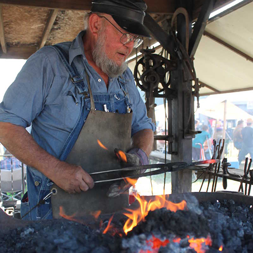 A blacksmith plies his trade at the WRVAA show in Elnora. | Photo courtesy of the Greene County Daily World
