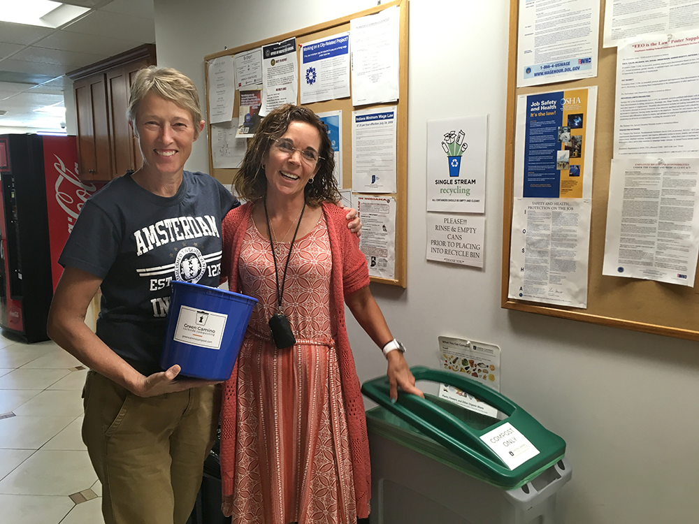 “The participation was far greater than we had guessed, and in the first week we had to increase our container size,” says Susie Johnson, Technical Support Manager at Envisage Technologies. Johnson, left, is pictured with coworker Julie Faulstich at the launch of Green Camino’s services at their office. Green Camino calculates that Envisage Technologies diverted about 775 pounds of compostable waste from the landfill in the first eight weeks of using the service. | Photo courtesy of Green Camino