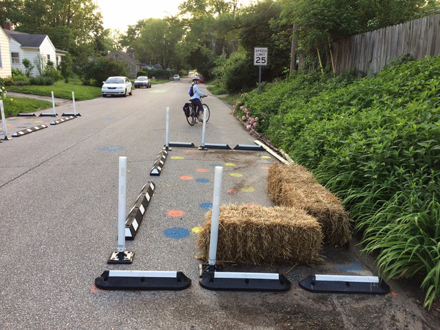 This image was from the Allen Street Greenway project. According to the website, “This project uses temporary materials including speed cushions and bump-outs in order to reduce motor vehicle speeds and increase comfort and safety for pedestrians and bicyclists on East Allen Street. This street was identified as a Neighborhood Greenway in the Bicycle and Pedestrian Transportation and Greenways System Plan. The temporary materials and pilot installation allow for residents and greenway users to provide feedback before committing to a permanent design for the Neighborhood Greenway.” | Photo by Jim Rosenbarger