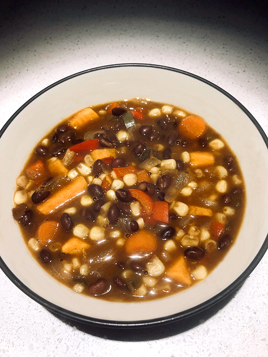 “Every family has its outliers,” writes Ruthie Cohen. The outlier in her family is Eve, aka “Mini Mommy,” the only one of Ruthie’s five children who shares her enthusiasm for cooking. Ruthie and Eve’s time in the kitchen has inspired some hearty winter fare, such as their Kickin’ Black Bean Vegetable Soup (pictured here). | Photo by Ruthie Cohen