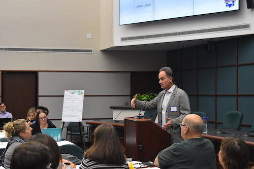 Alex Crowley speaking about the CDFI Friendly City during a BEAD Summit at City Hall | Photo by Katlin Suter