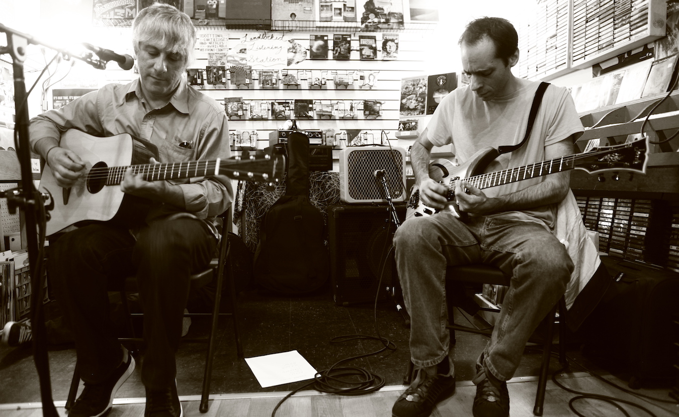 Landlocked Music has hosted about 50 in-store performances since it opened in 2006. Lee Ranaldo (left) of Sonic Youth and Alan Licht played at Landlocked in 2012. Ranaldo also recited a poem about Bloomington that he had written in 1991. | Photo by Jeremy Hogan