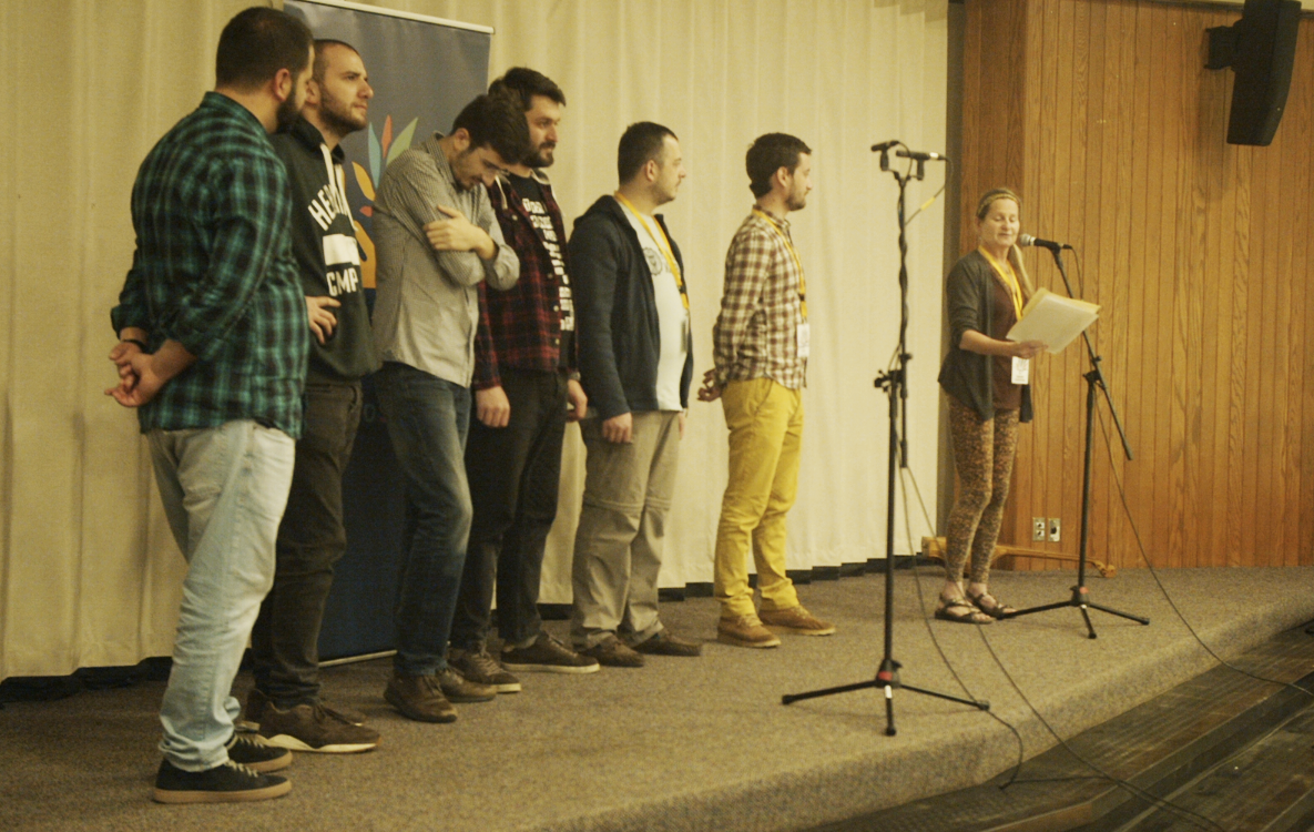 Tamara Loewenthal (far right), the new executive director of Lotus Education &amp; Arts Foundation, introduced the members of the Georgian a cappella group Adilei before their performance at Childs Elementary in April. | Courtesy photo