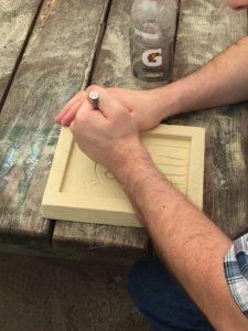 Besides watching cast iron sculptures being created, visitors can make cast art themselves by using sand scratch blocks. | Photo by Laurie D. Borman