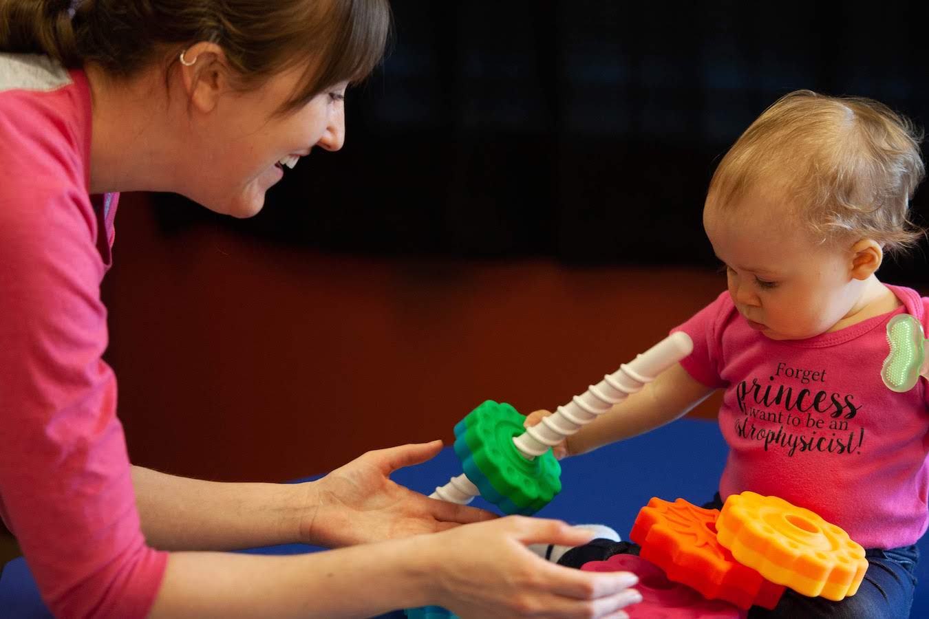 Katie Burris plays with her daughter Cecily at WonderLab. The new exhibit, called Science Sprouts Place, includes two main areas, Baby Wonders and Toddler Trails, an adjacent area called Sprouts Lab for wet and messy experiments, and a dedicated nursing space that doubles as an area for stories and quiet time. | Photo by Andrea Golden, for WonderLab