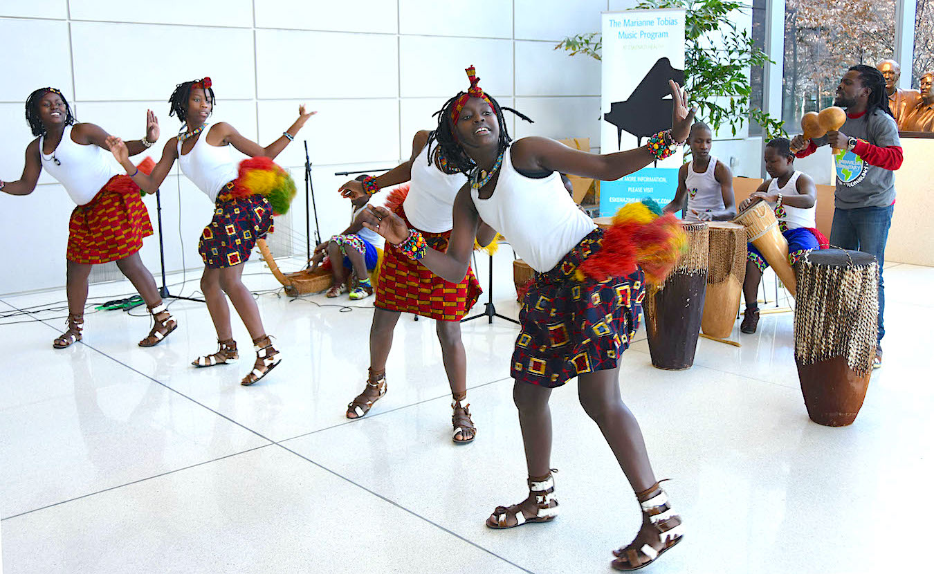 Lotus Education &amp; Arts Foundation is known for its vaunted world music and arts festival each fall, but Lotus’s other events and activities serve people year-round. Lotus Blossoms, one of its education programs, enriches the lives not just of children throughout central and southern Indiana but also of the adults who help make the programs happen. Pictured here, the Ugandan group Dance of Hope performed at Eskenazi Health in Indianapolis in 2018. | Photo courtesy of Lotus Education &amp; Arts Foundation