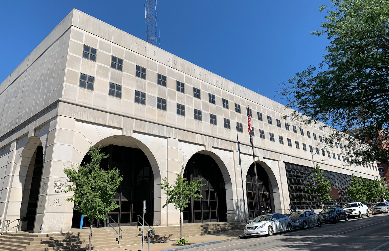 The Charlotte Zietlow Justice Building on North College is where evictions will resume when the evictions moratorium ends. It also houses the Housing and Eviction Prevention Program (HEPP), which offers legal aid, mediation, and housing navigation services for renters. | Photo by Paige Strobel