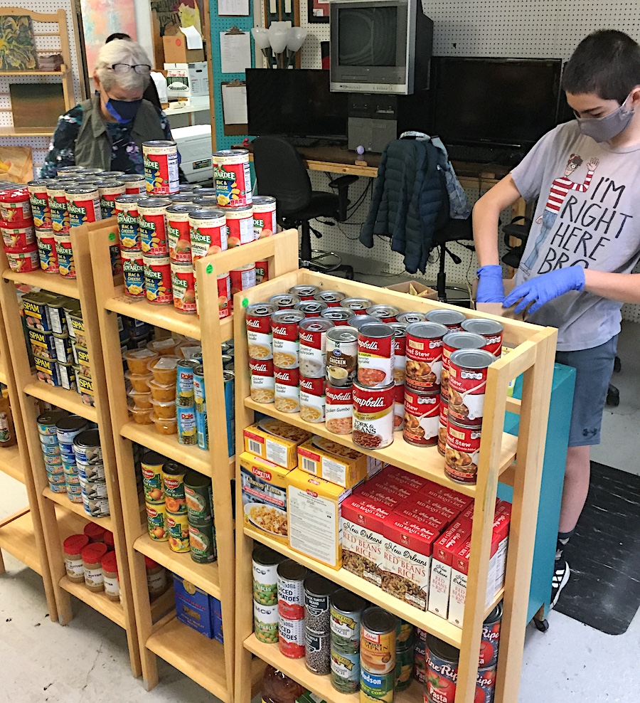 Jana Pereau (left) works at the Pantry with another volunteer. Each week, Pereau and Babb transport goods they’ve selected from the Hoosier Hills Food Bank to stock the Pantry. They hauled 187 pounds of food on the inaugural trip. | Limestone Post